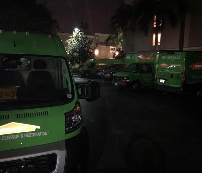 SERVPRO vans parked outside commercial facility.